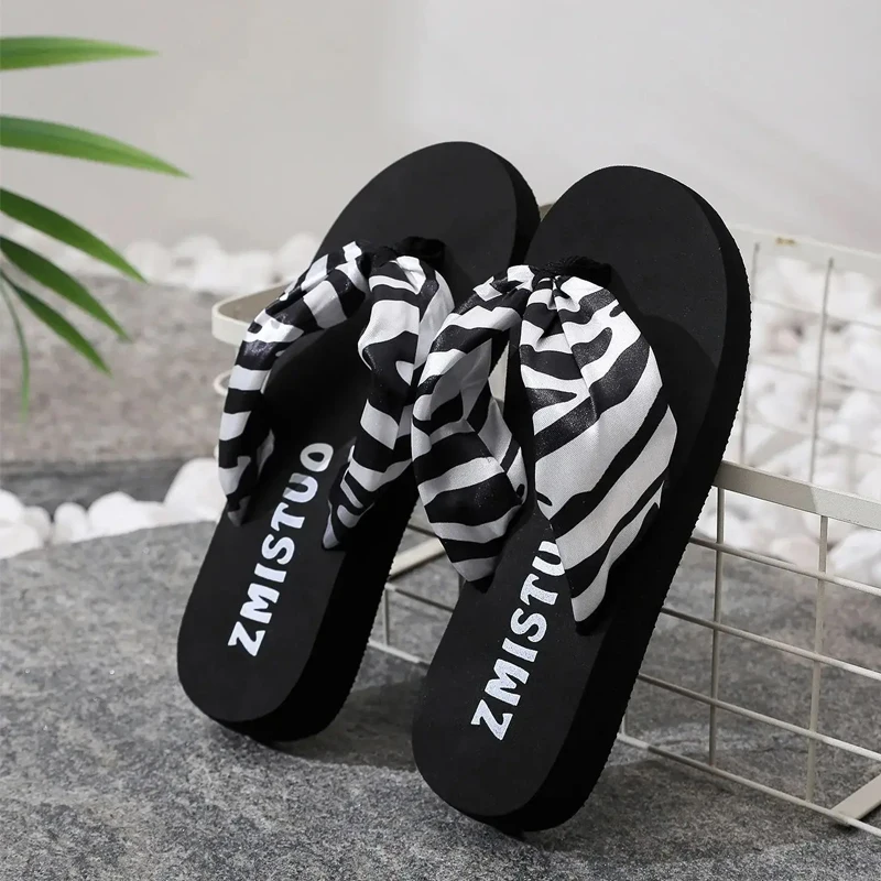 women’s black slippers