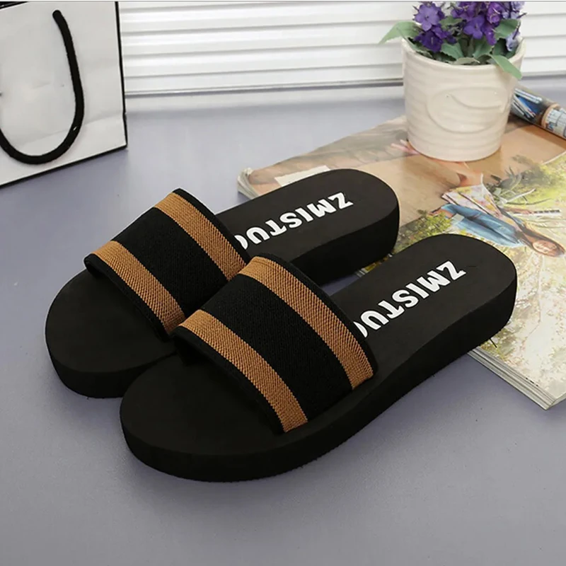 women’s black slippers