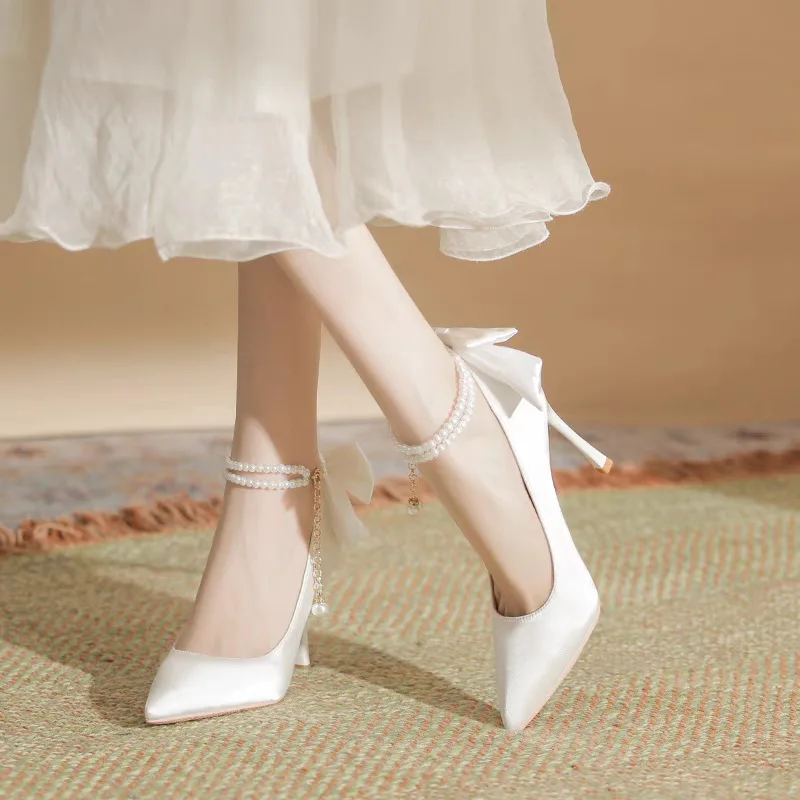 white heels with bows